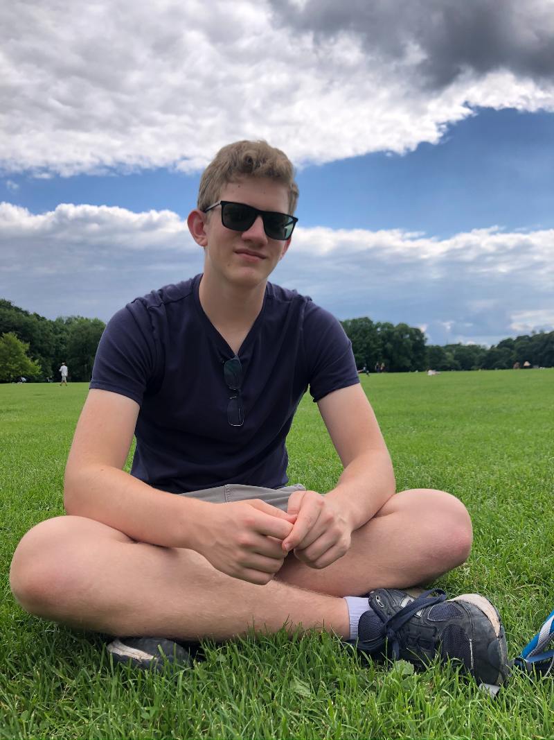 Boy sitting in the Englischer Garten
