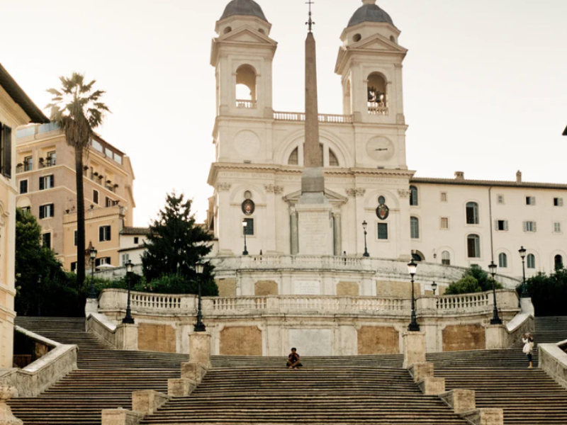 A person sitting on the Spanish Steps.